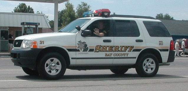 Sheriff Deputy Waving from Patrol Vehicle